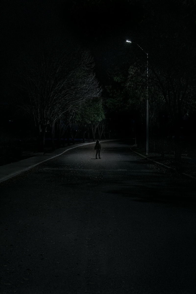 Lone figure under streetlamp